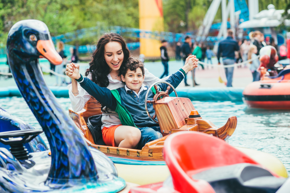 Son and mother in the amusement park.